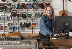 Business owner at the till