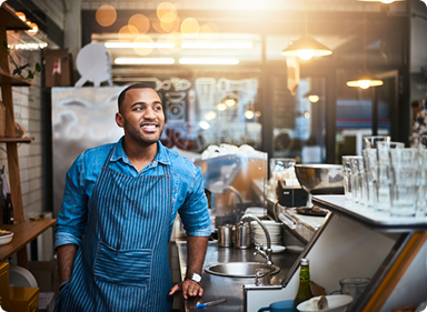 Person stands in a coffee shop