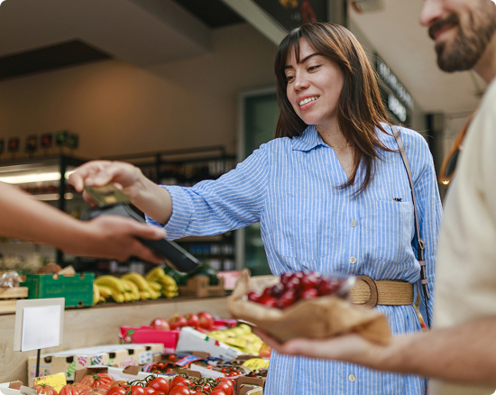 Person pays for cherries at a store