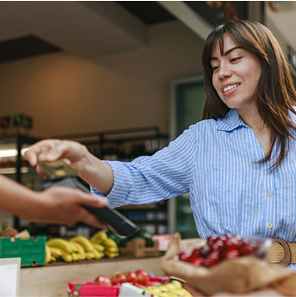 Person pays for cherries at a store