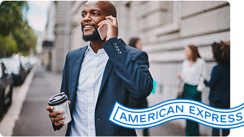 Person talks on phone while holding coffee