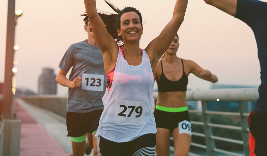 Girl running with arms up