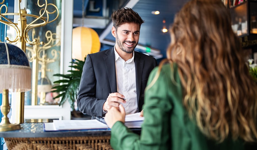 Businessman checking into hotel