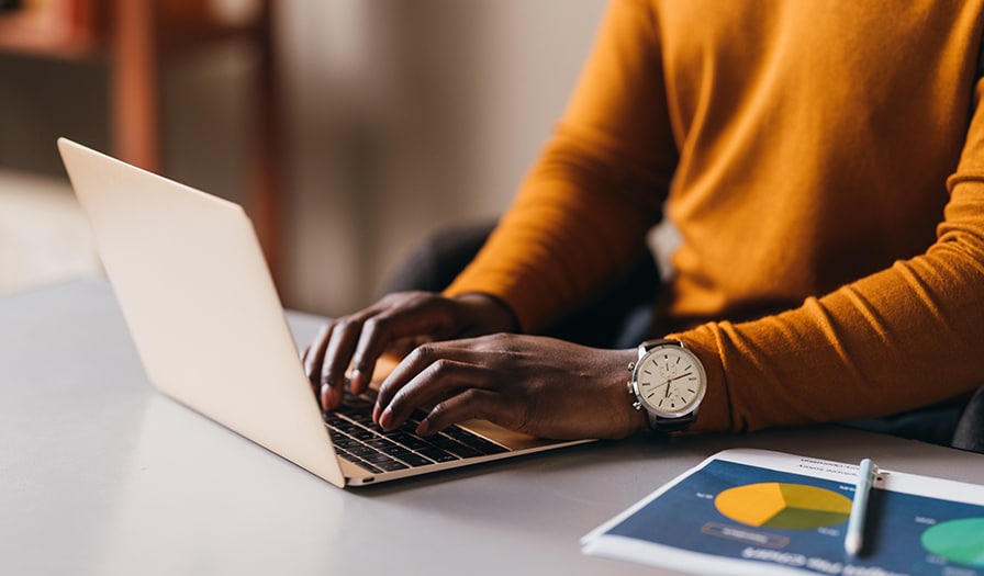 Person typing on laptop
