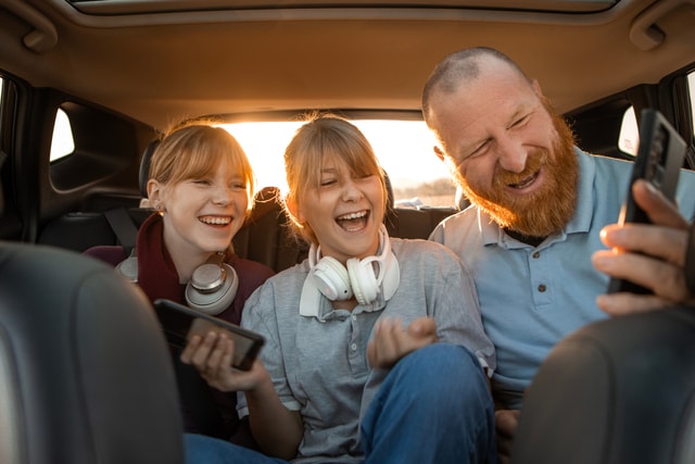 Ride Sharing fun father and two daughters.