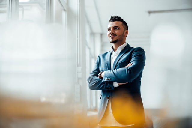 A man standing with his arms crossed.