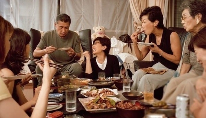 A big family enjoying a meal together.