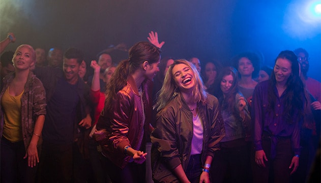 A group of people dancing at a night-club