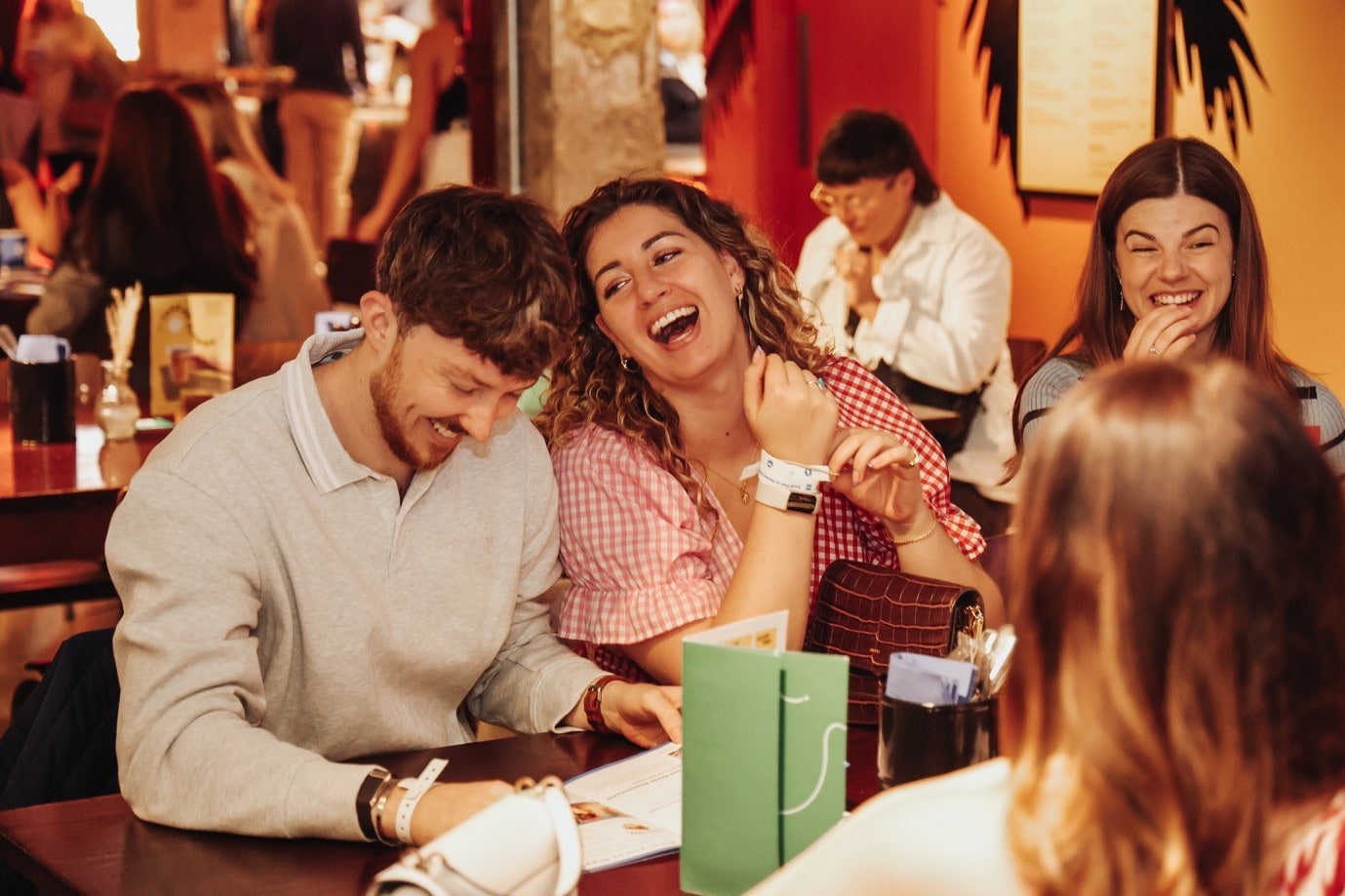 A group of people enjoying food and drinks at London Restaurant Festival