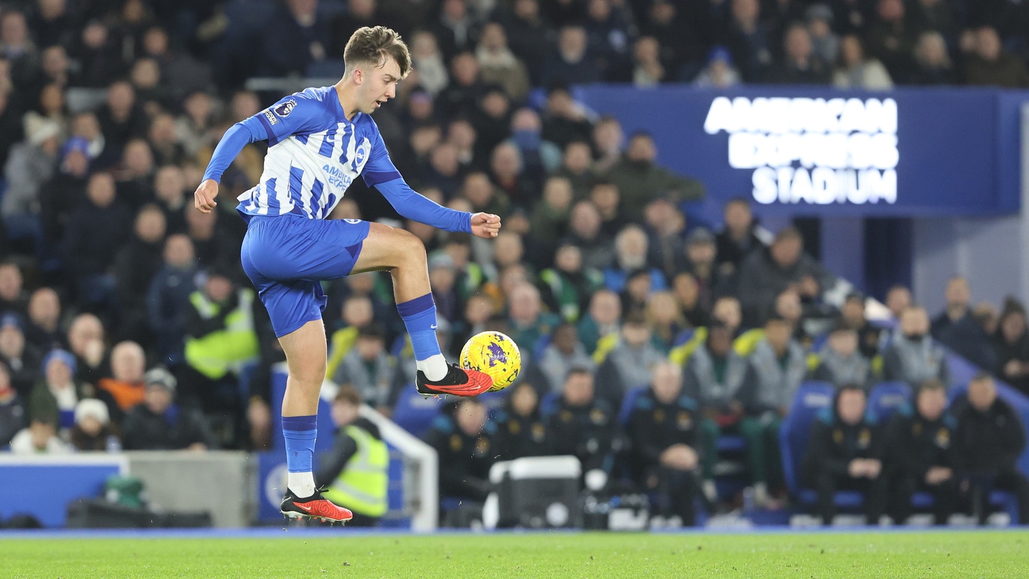A Brighton & Hove Albion player controlling a ball in the air.