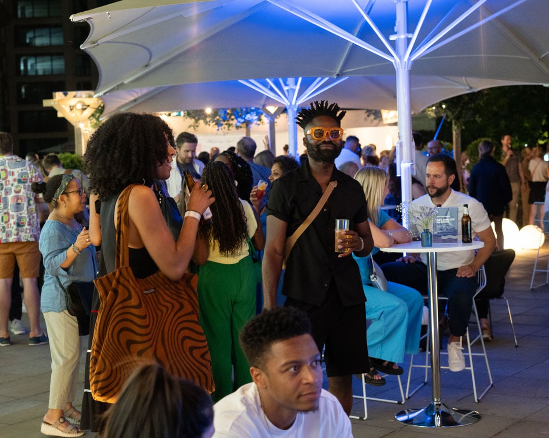 A group of people at the American Express Lounge at Somerset House