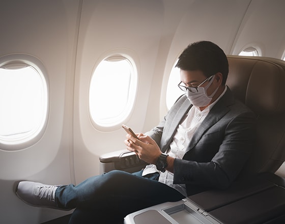 Airline passenger wearing mask