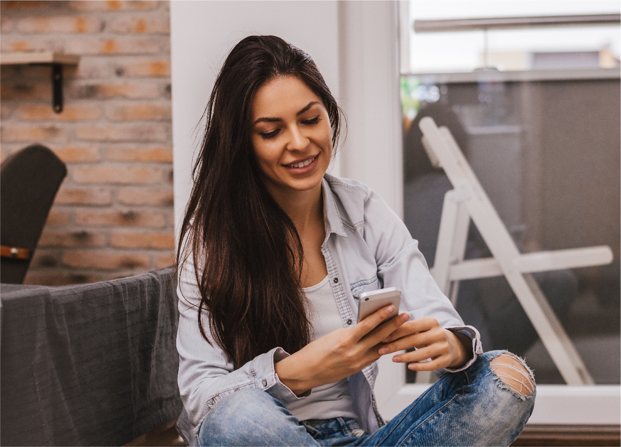 Woman on phone and laptop
