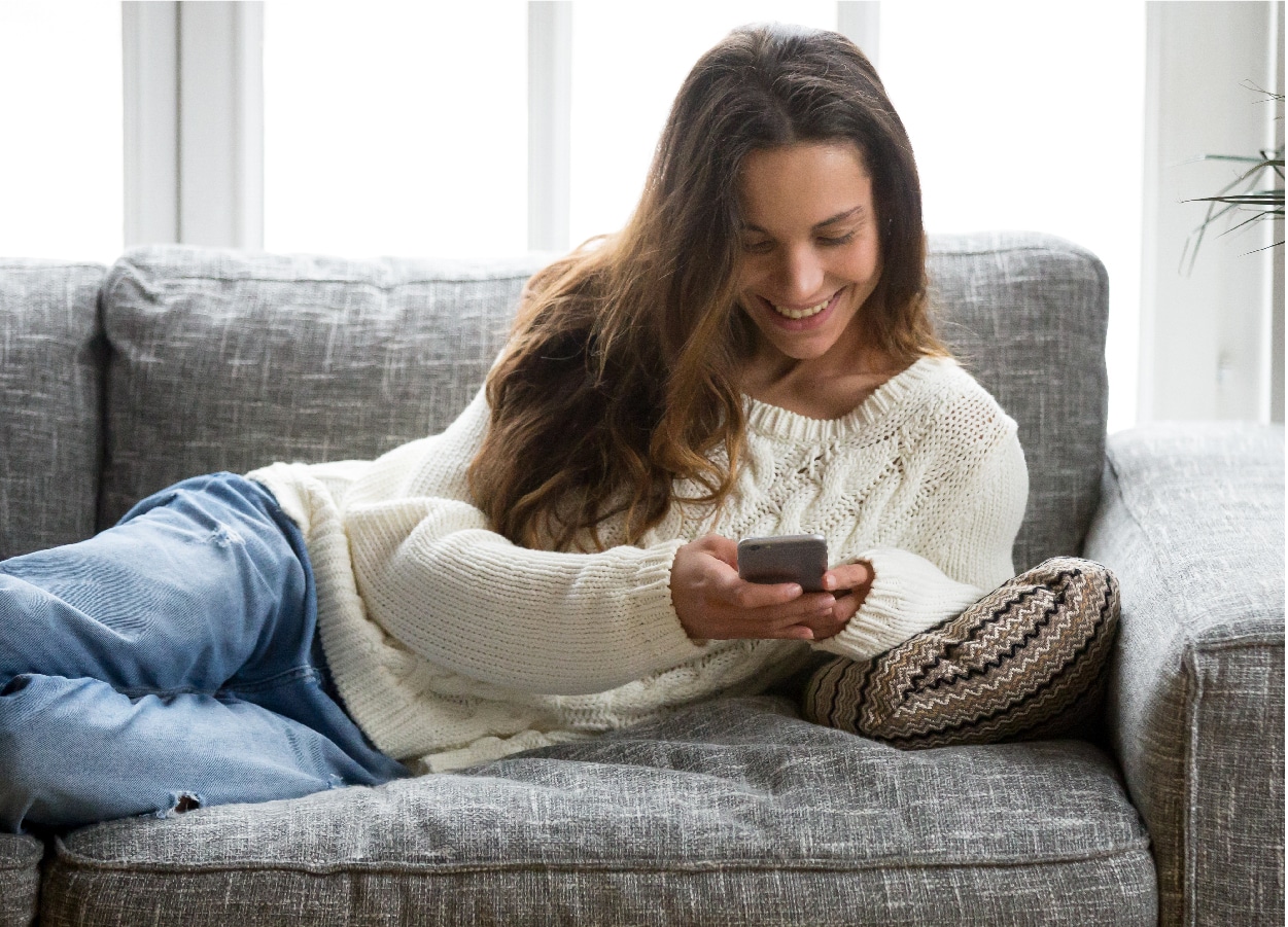 Woman on phone and laptop