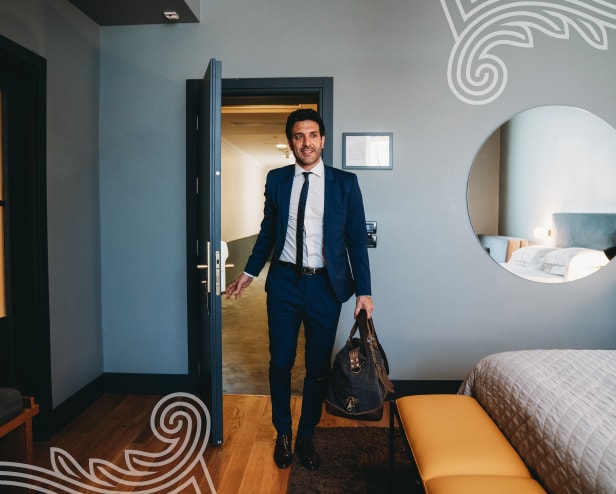 A person sitting with lauguagge bag