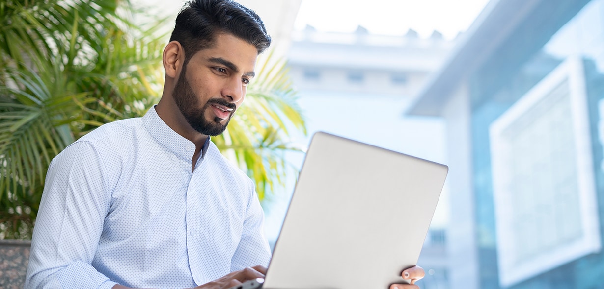 Person looking at laptop 