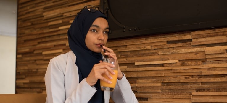 Person with orange juice