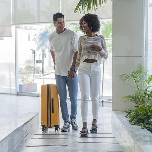 Couple arriving for a stay in a hotel