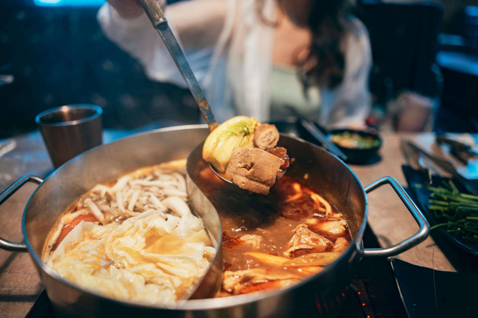 woman pulling a hand into a nightclub
