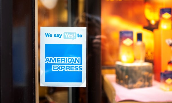 American Express signage in storefront window that says We say Yes to American Express