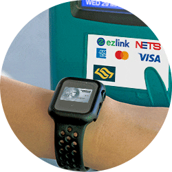 Subway turnstile screen displaying the OMNY logo, a contactless symbol, and the words "tap here"