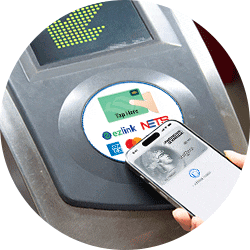 Subway turnstile screen displaying the OMNY logo, a contactless symbol, and the words "tap here"