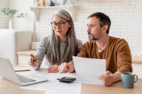 two people looking at a computer