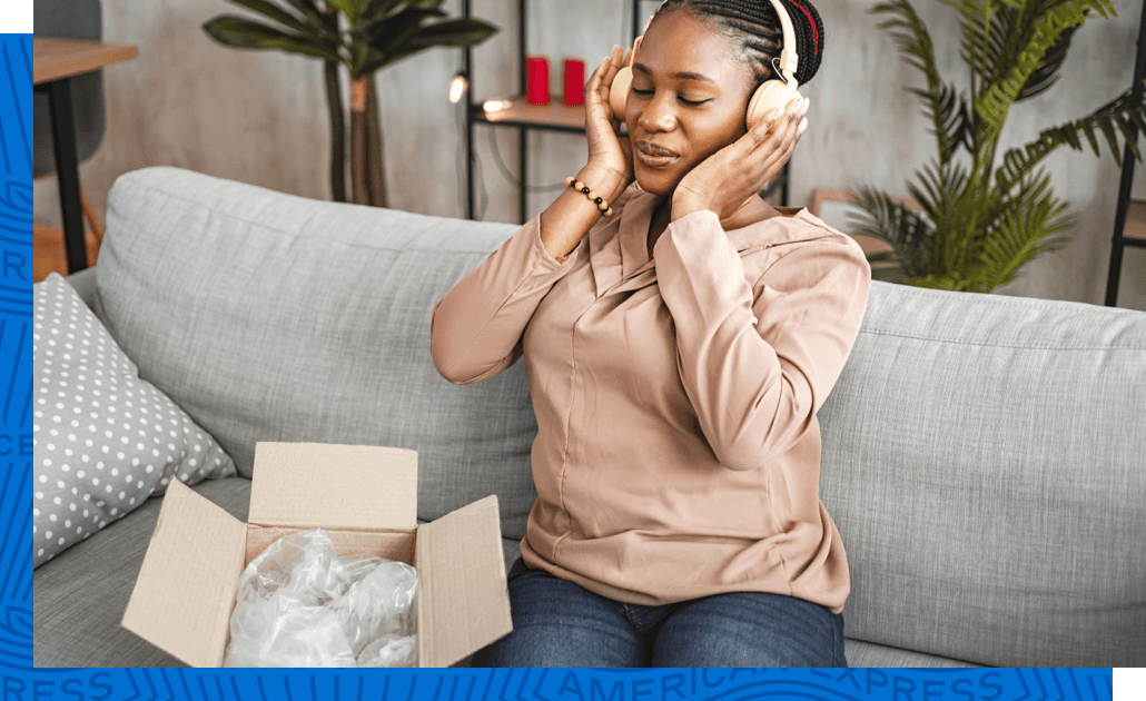 Card Member enjoying their new headphones