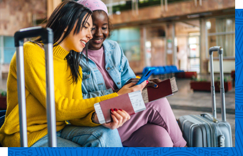 A pair of friends using Google Pay to book an experience during an international trip.