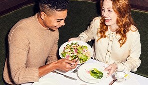 Couple eating at table