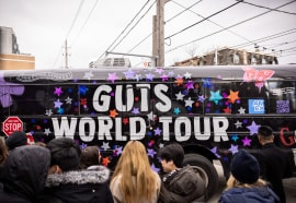 Picture of tour bus with GUTS written across it