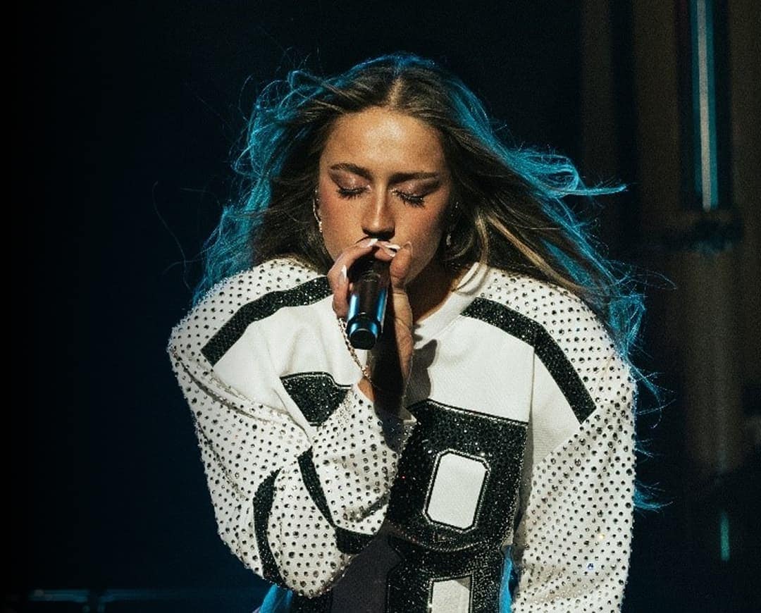 Tate McRae performing at Album Release Event