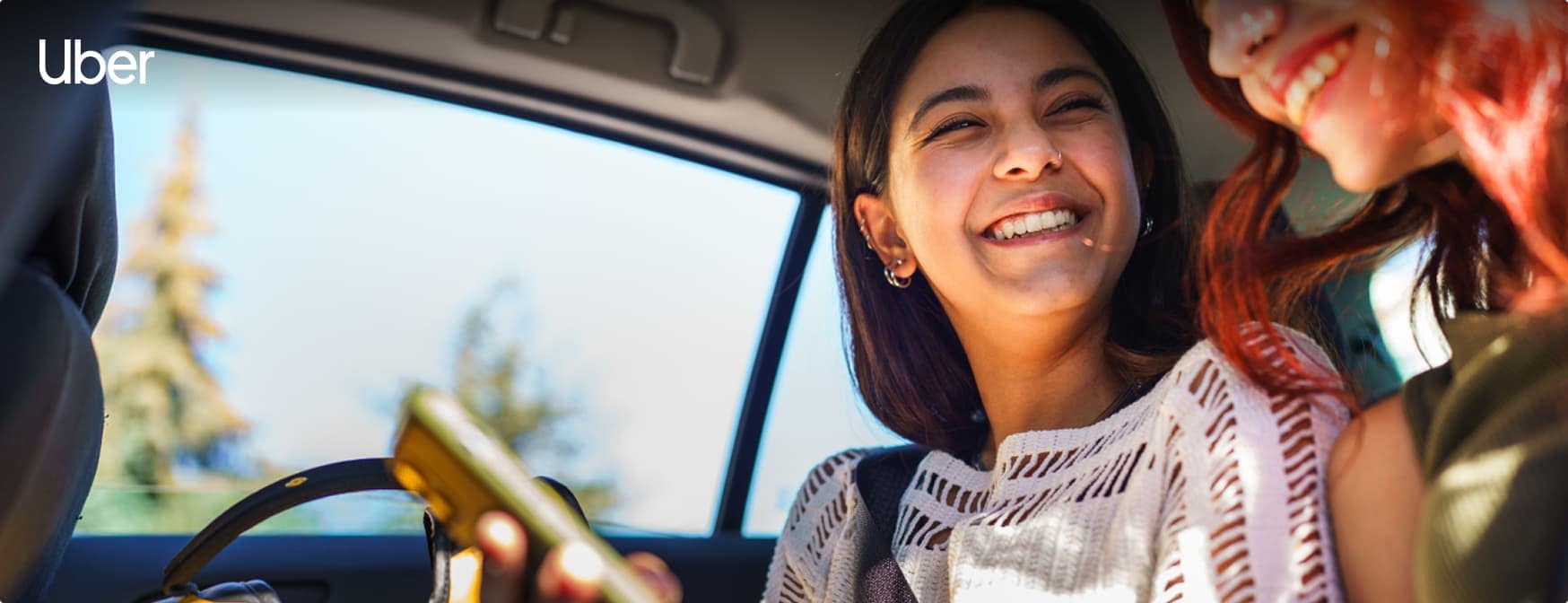 Two people in the back of a car