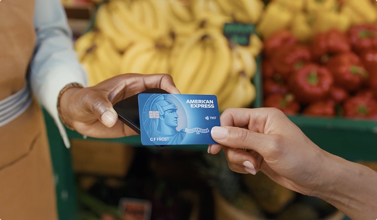 Person tapping to pay with American Express Card