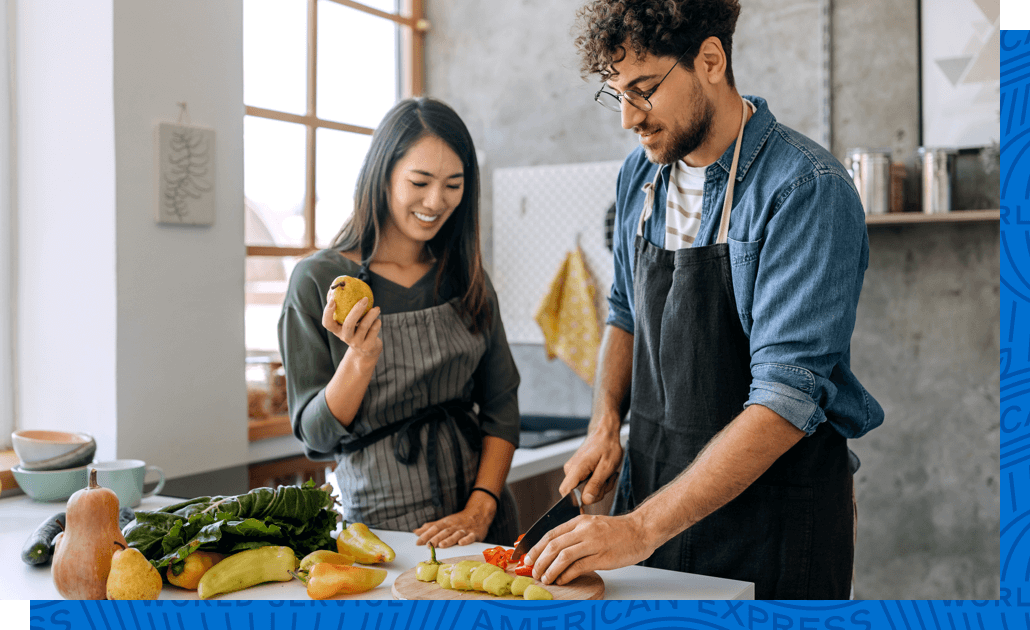 A couple making dinner with groceries they ordered at Amazon.com.