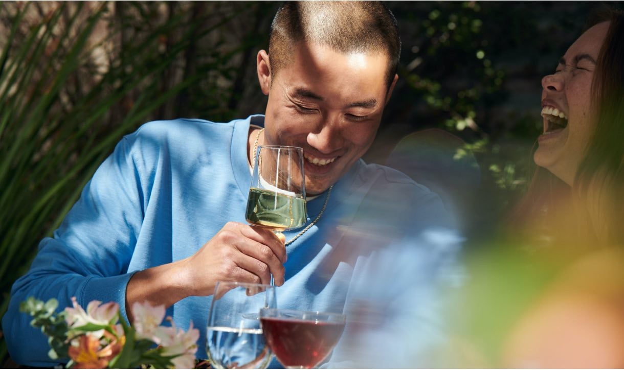 American Express Platinum Card Member enjoying a glass of wine