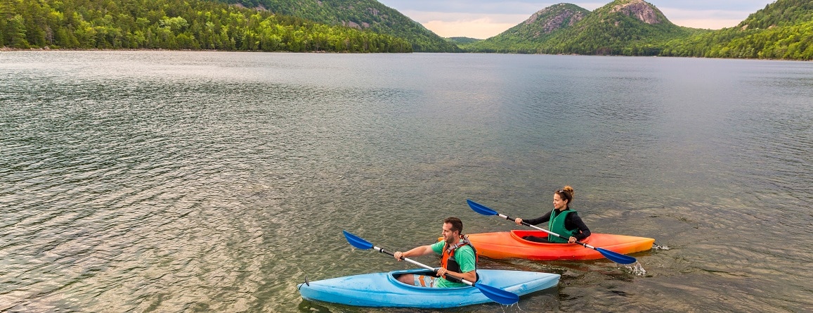  Couple kayaking in lake