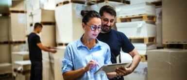Woman taking notes in warehouse