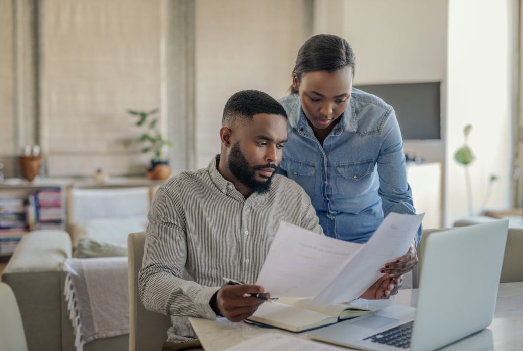 Man and woman looking at business documents.