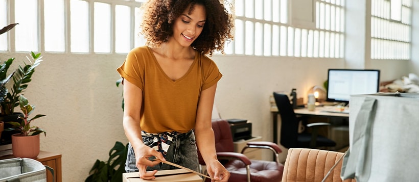 An entrepreneur smiling inside her business