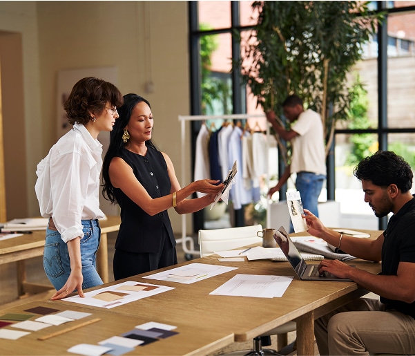 Group of colleagues collaborating in an workspace.