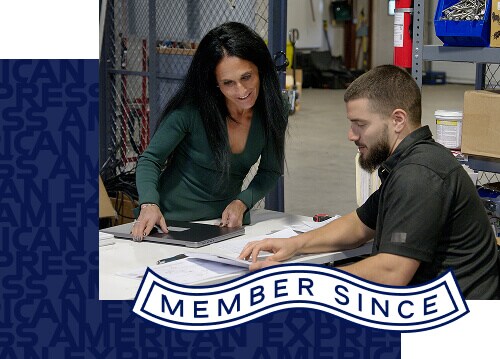 Two office workers looking over paperwork