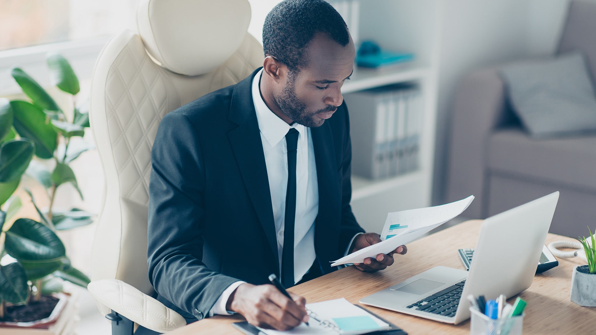 Man sitting at his desk working on his computer