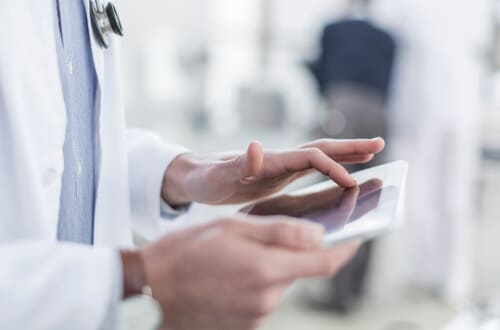 Medical professional using tablet