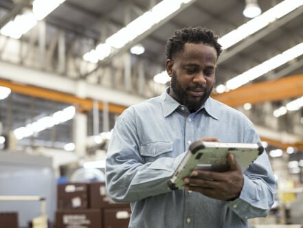 Man using tablet in warehouse