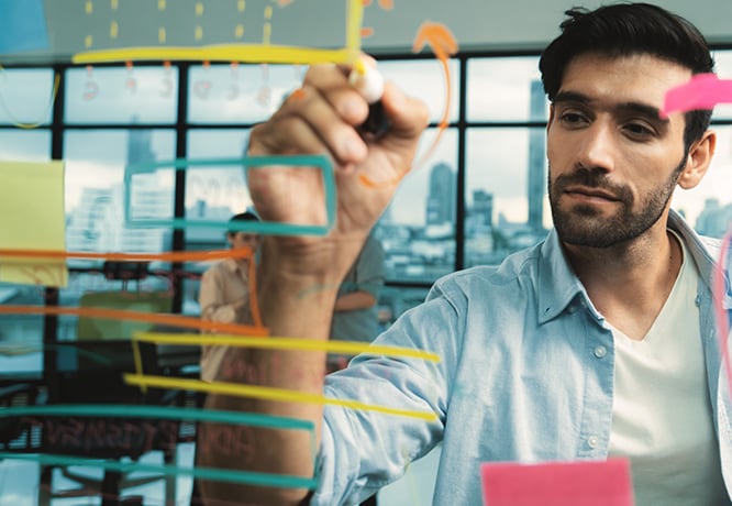 An employee working after watching an inspiring Business Class video. 