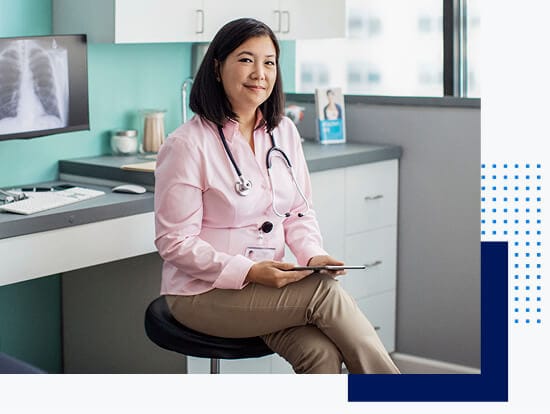  Doctor sitting near her workstation