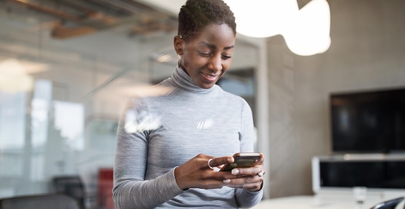 Woman texting on cell phone.