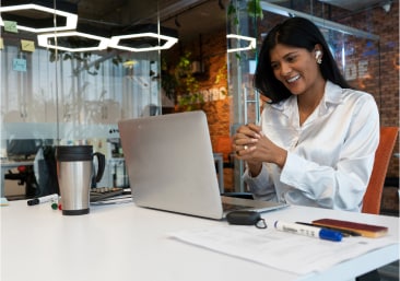 Woman sitting in the office on a video call.