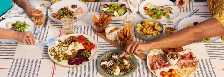 Two store associates reviewing a tablet